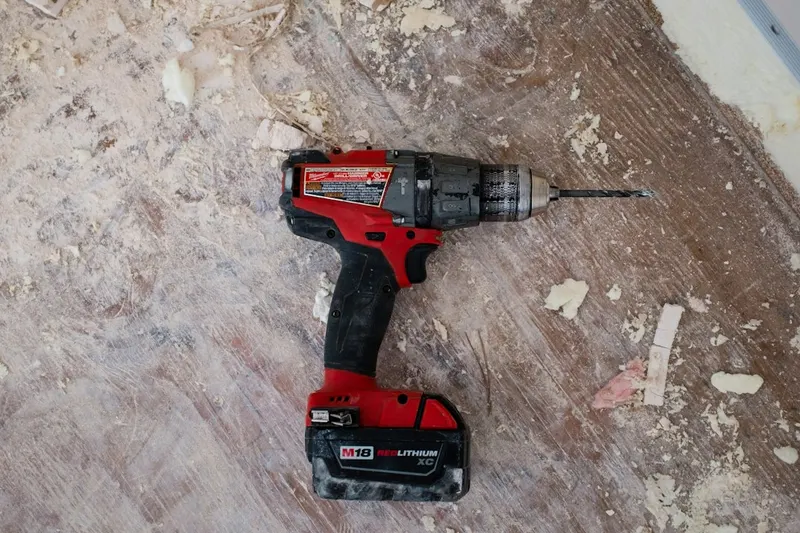 Skilled handyperson installing fixtures and assembling furniture in a Maltese apartment